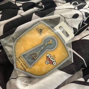Disney Pluto Key in Yellow and Gray pin
